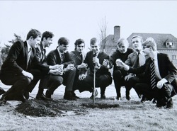 Students plant a tree in the grounds of Churchill Hall
