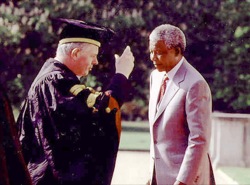 Nelson Mandela at Buckingham Palace with the then Vice-Chancellor, Sir John Kingman 