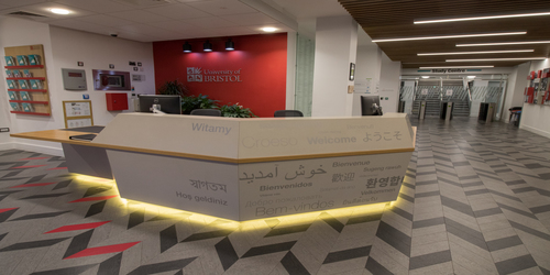 The reception desk at Beacon House. The word 'welcome' is written across it in various languages.