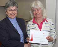Professor Christine Willis (right) from the School of Chemistry receives a Teaching Award from Professor Avril Waterman-Pearson