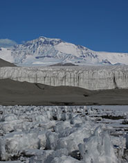 The ice margin of an Antarctic glacier, depicting frozen lake sediments in the foreground. When ice sheets form, they overrun organic matter such as that found in lakes, tundra and ocean sediments, which is then cycled to methane under the anoxic conditions beneath the ice sheet.