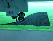Manufacturing process of a Variable Angle Tow layer using tow embroidery