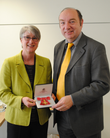 Professor Marianne Hester receives her OBE from Norman Baker, the Minister for Crime Prevention