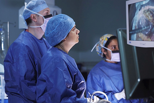 Surgical team in an operating theatre, working on a patient