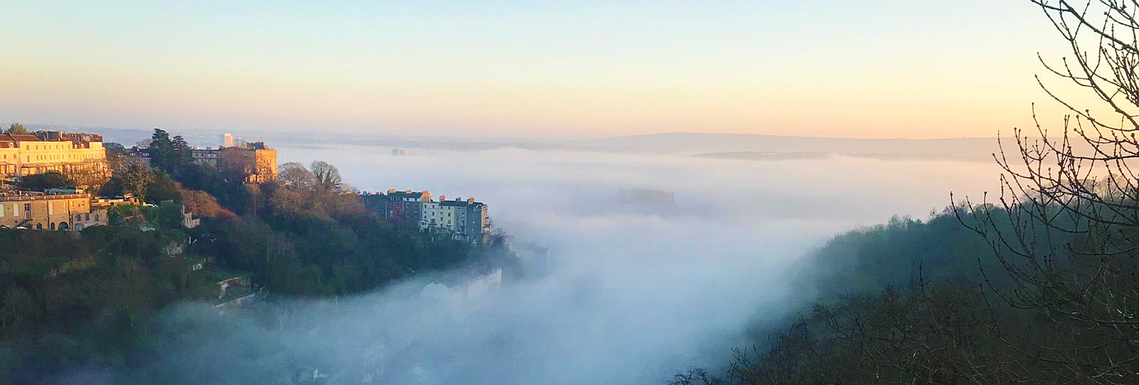 View from Clifton Suspension Bridge looking back into Bristol with low level mist.