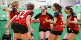 Girls celebrating volleyball win, select image to go to Bristol SU "find a group" page