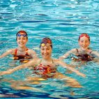 3 women synchronised swimming in a pool. Links to Synchronised Swimming club page on Bristol SU Website.